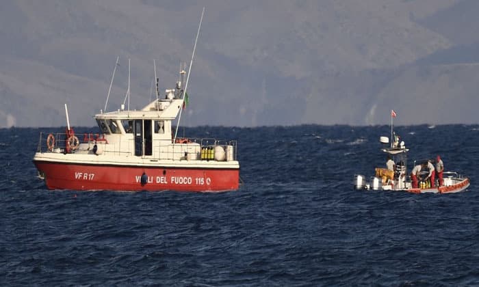 rescue-crews-unload-body-bag-in-sicily-port-as-search-continues-after-yacht-sinking